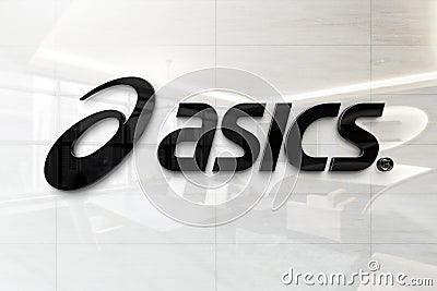 Asics on glossy office wall realistic texture Editorial Stock Photo